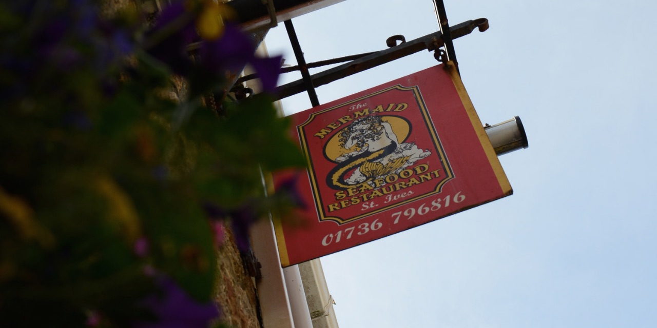 The Mermaid's traditional red and gold restaurant sign